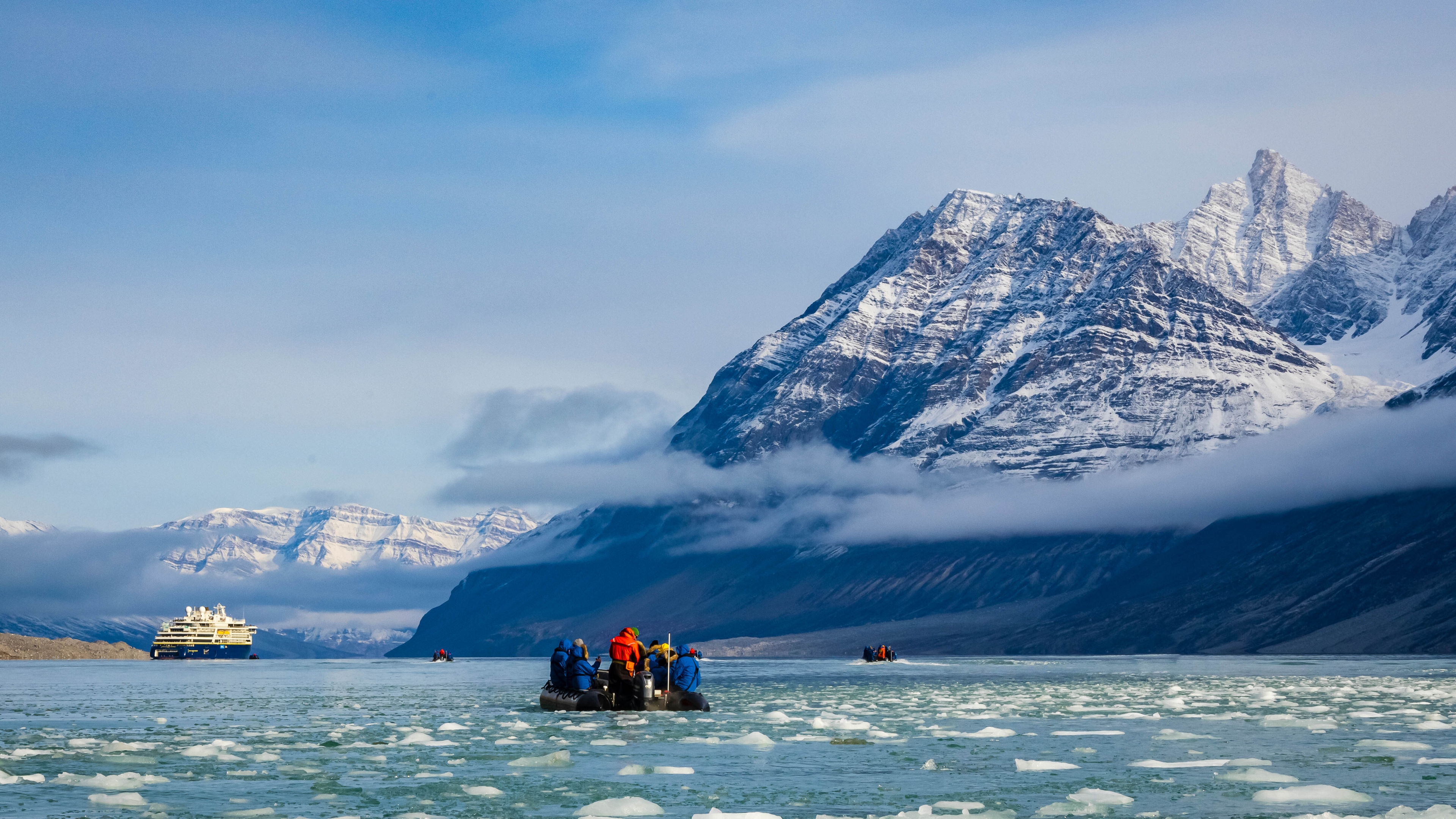 Guests exploring Tidewater Glacier by Zodiac from the ship National Geographic Endurance, Alpejord Fjord, Northeast Greenland National Park, Greenland