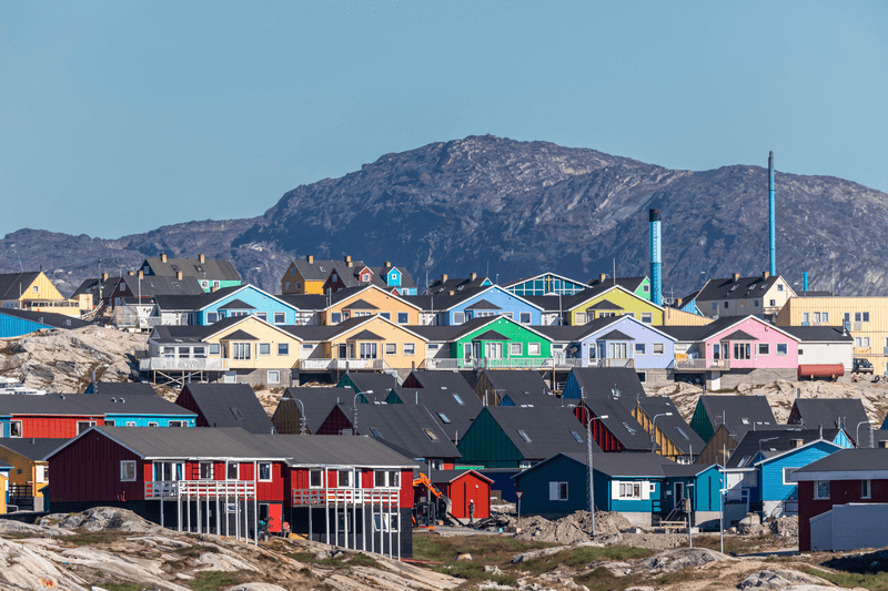 A view of colorfully painted houses in the city of Ilulissat, Greenland.