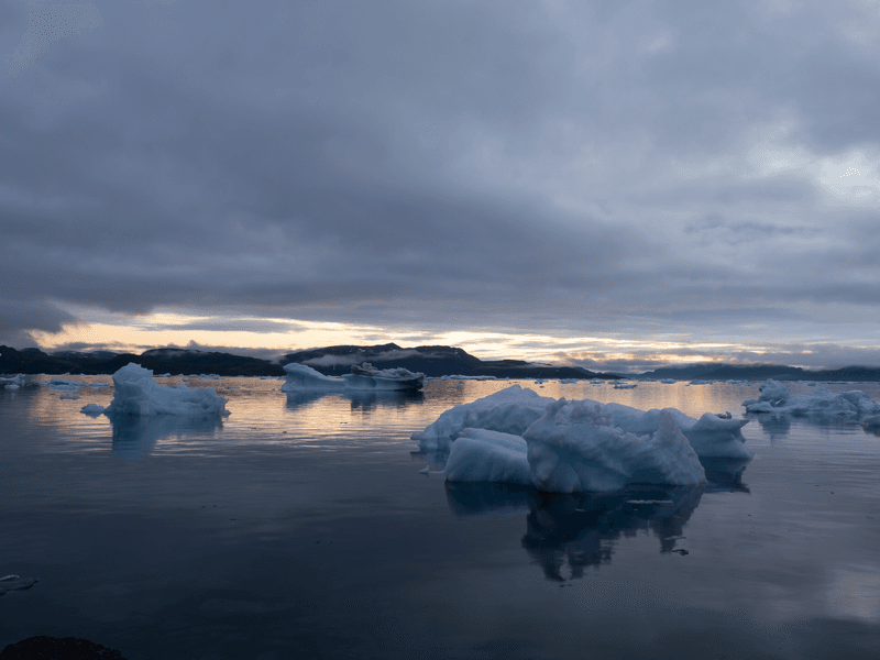 The iceberg filled waters of the Tunulliarfik and Sermilik Fjords on the shores of the port settlement of Narsaq, Southern Greenland