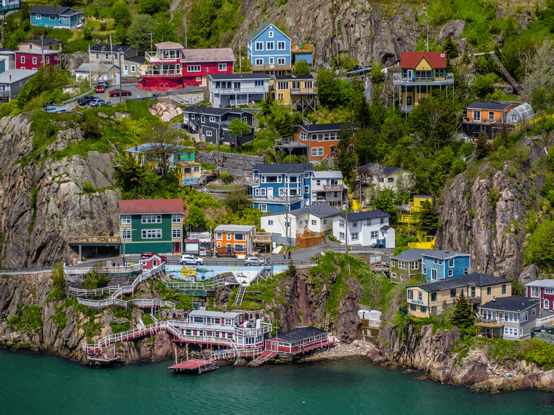 Aerial view of beautiful colorful houses built on the rocky slope of the Signal Hill in St. John's Newfoundland, Canada