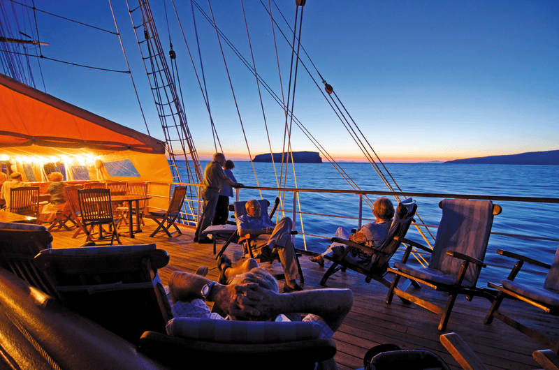 Guests enjoy the Lido deck lounge on the ship Sea Cloud