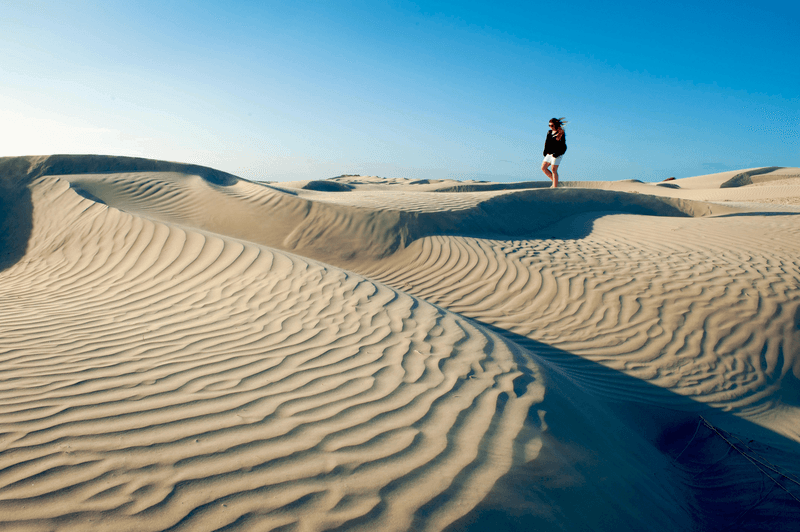 Traveler, Isabella Lindblad, walking the Magnificent Magdalena Bay Sand Dunes in Baja California