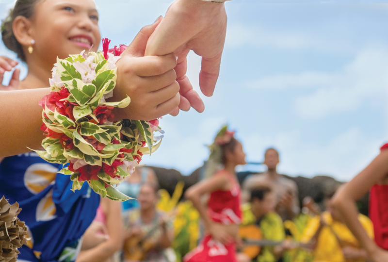 A local woman wearing flower bracelet at a cultural event in Marquesas, French Polynesia