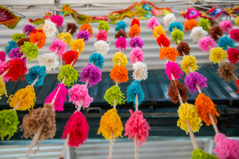 Cords of brightly colored Yarn Tassels
 on display at the Indian Market in the Miraflores neighborhood of Lima, Peru.