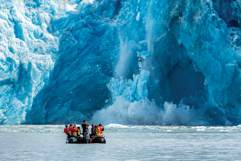 Guests explore calving ice by zodiac in Alsaka, USA