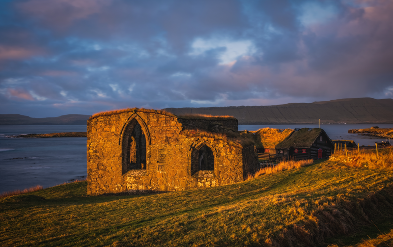 The ruins of St. Magnus Cathedral in Kirkjubour Kirkebo a historical village on Streymoy, Faroe Islands. The ruins are the largest medieval building in the Faroe Islands
