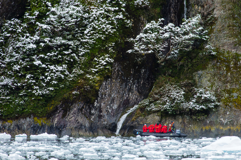 Zodiac and Waterfall, Garibaldi Fjord,  Darwin Range, Augustini National Park, Tierra Del Fuego, Patagonia, Chile