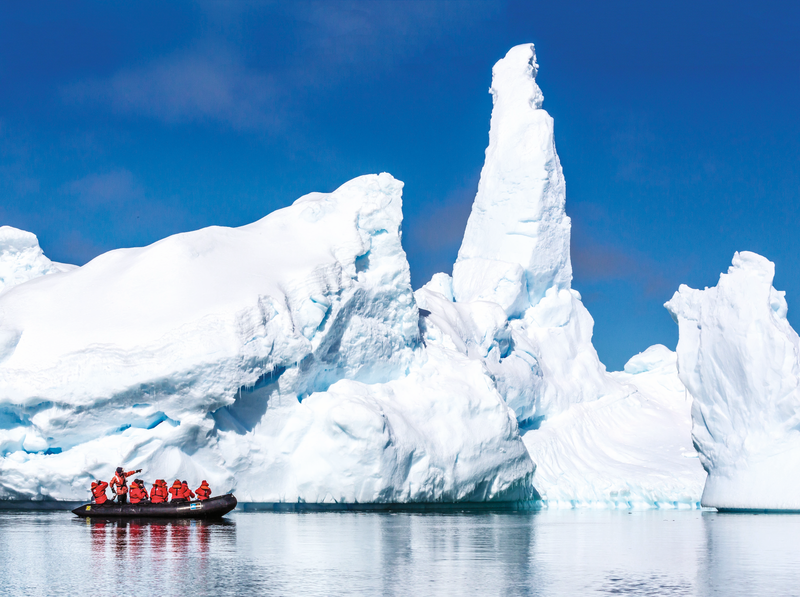 Guests from the Lindblad Expedition ship National Geographic Explorer enjoy the Yalour Islands, Antarctica by Zodiac