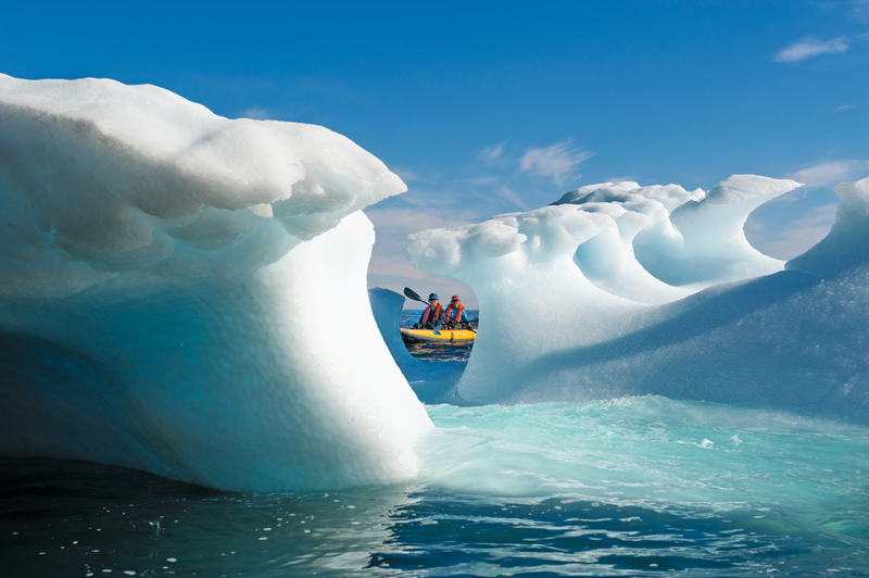 Traveler, Isabella Lindblad, and guest exploring by kayaking in Greenland