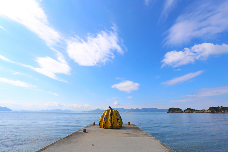 Yayoi Kusama's giant pumpkin sculpture in front of the sea. in Naoshima Art island, Japan