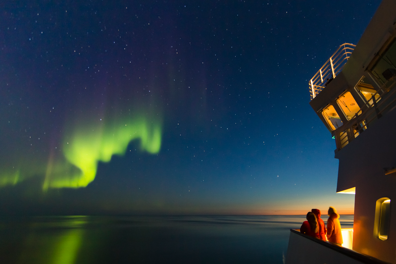 Guests view the Northern Lights from the ship National Geographic Explorer, Foxe Basin, Nunavut, Canadian Arctic, Canada