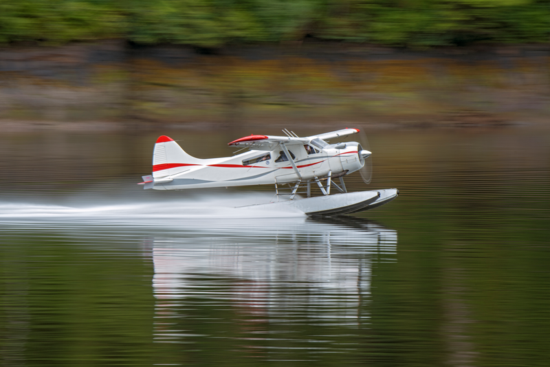 Floatplane taking off in Punchbowl Bay in Misty Fjord National Monument in Southeast Alaska.