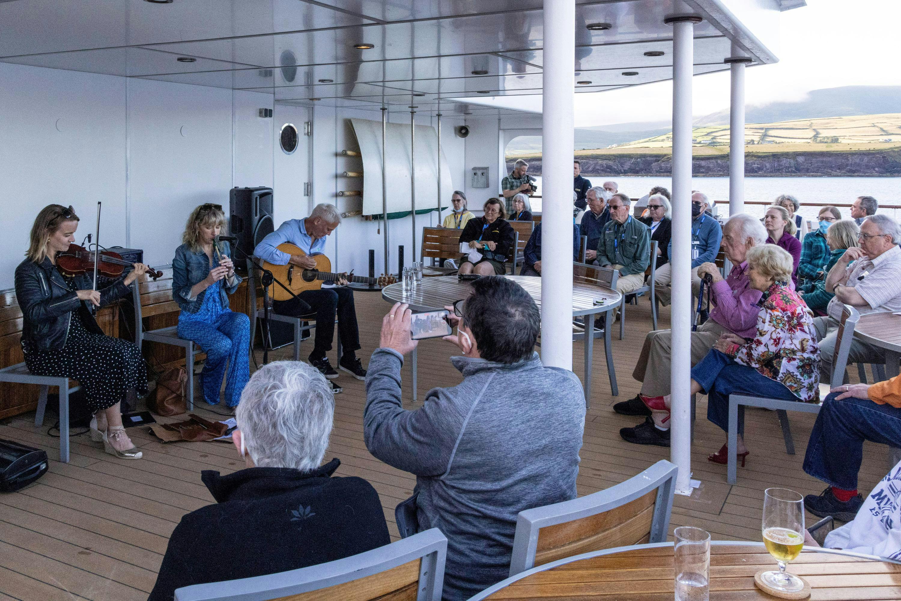 Guests in listenign to local music, Dingle, Country Kerry, Ireland.