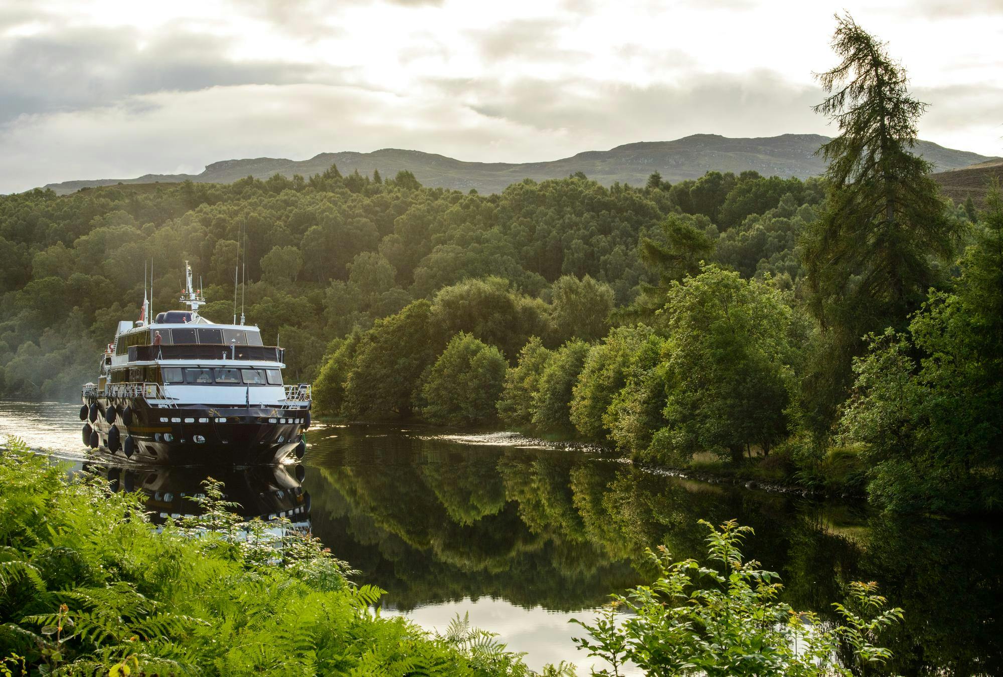 The ship Lord of the Glens cruising in Caledonian Canal, Scotland
