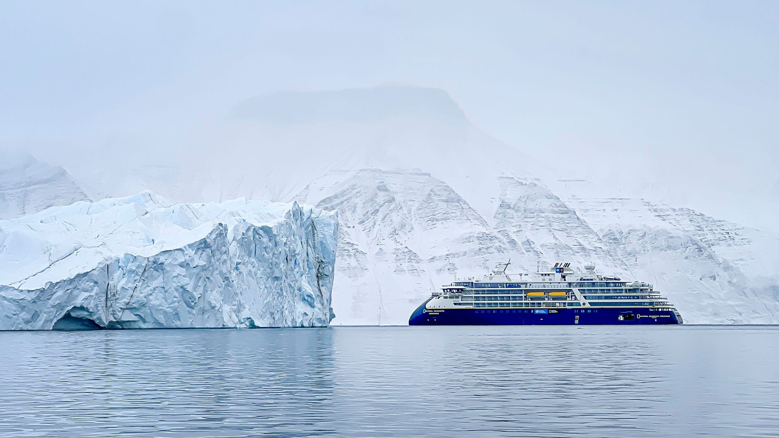 national geographic endurance in front of a glacier