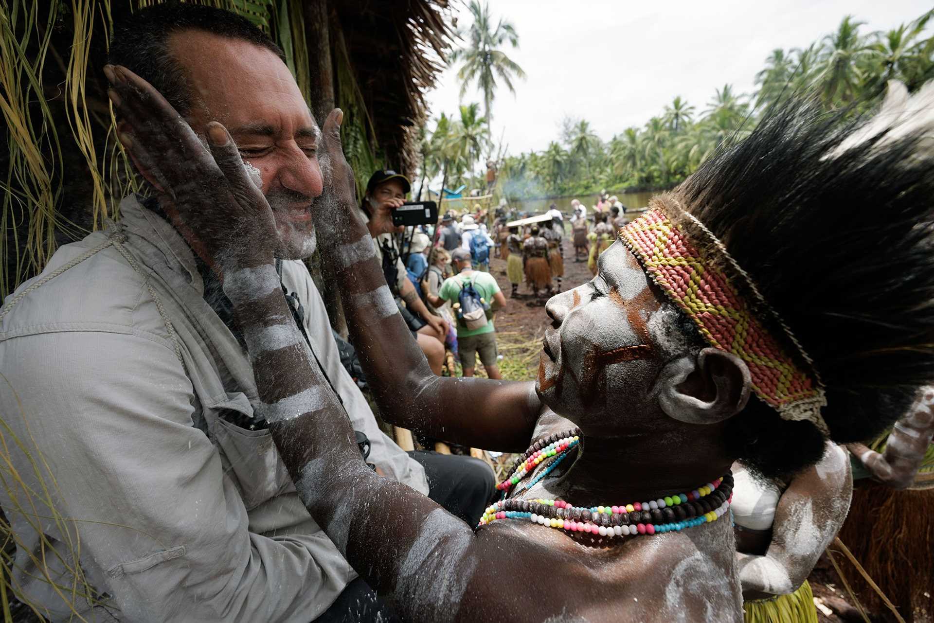 asmat warrior greeting a visitor