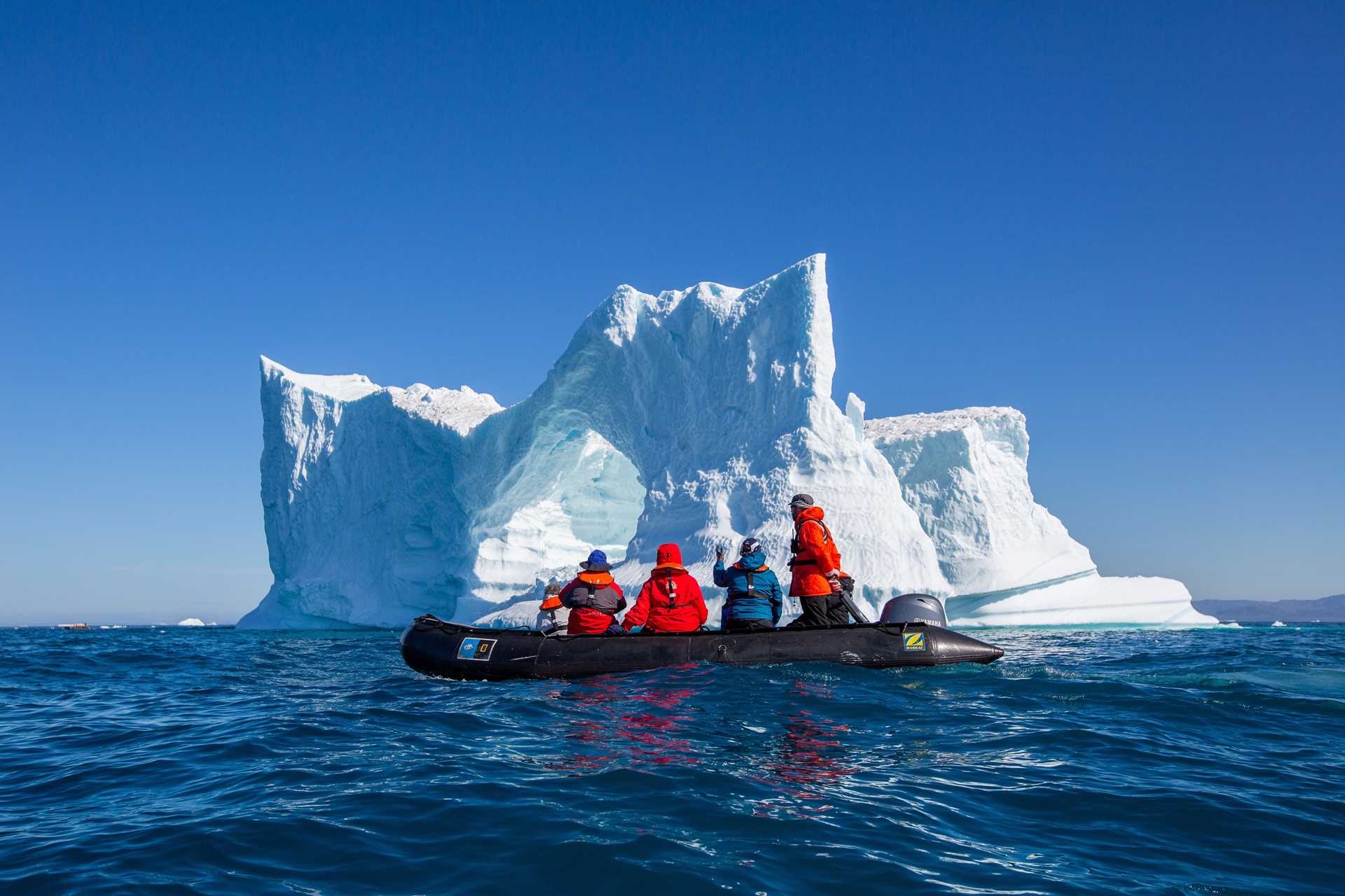 Zodiac in front of iceberg in Ilulissat, Greenland