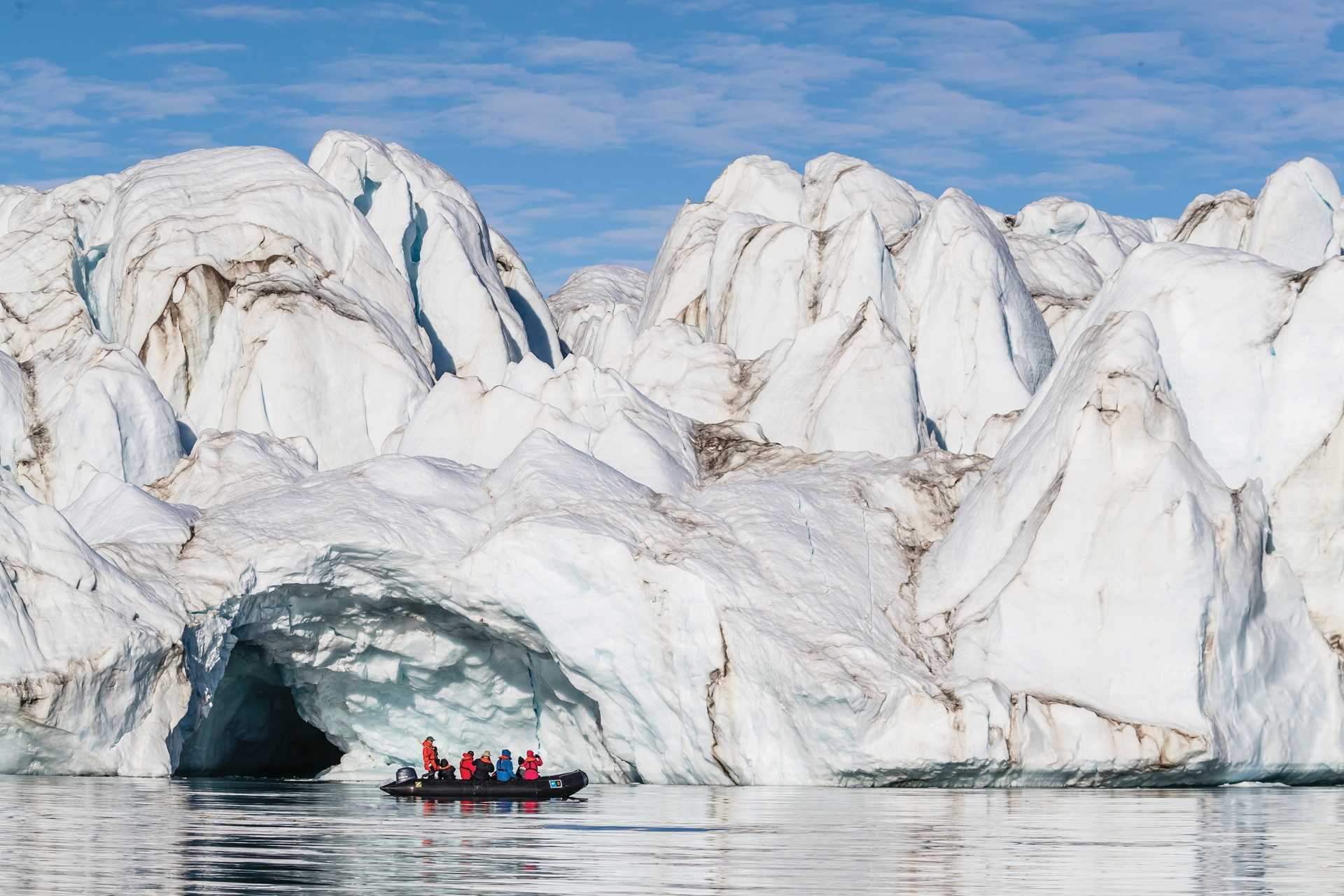 A Zodiac cruises past a glacier in Arctic Canada