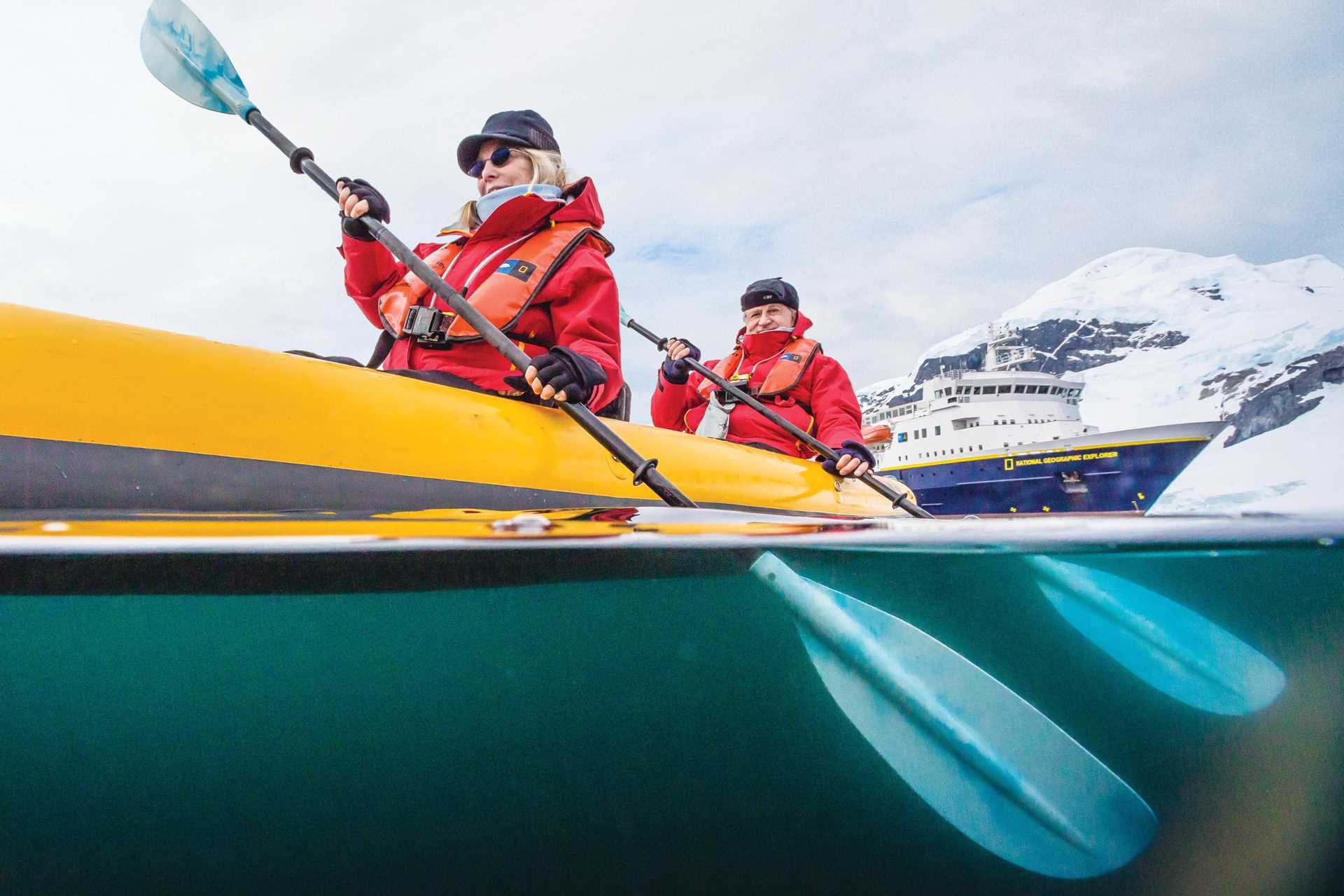 Kayaking couple in Antarctica.jpg