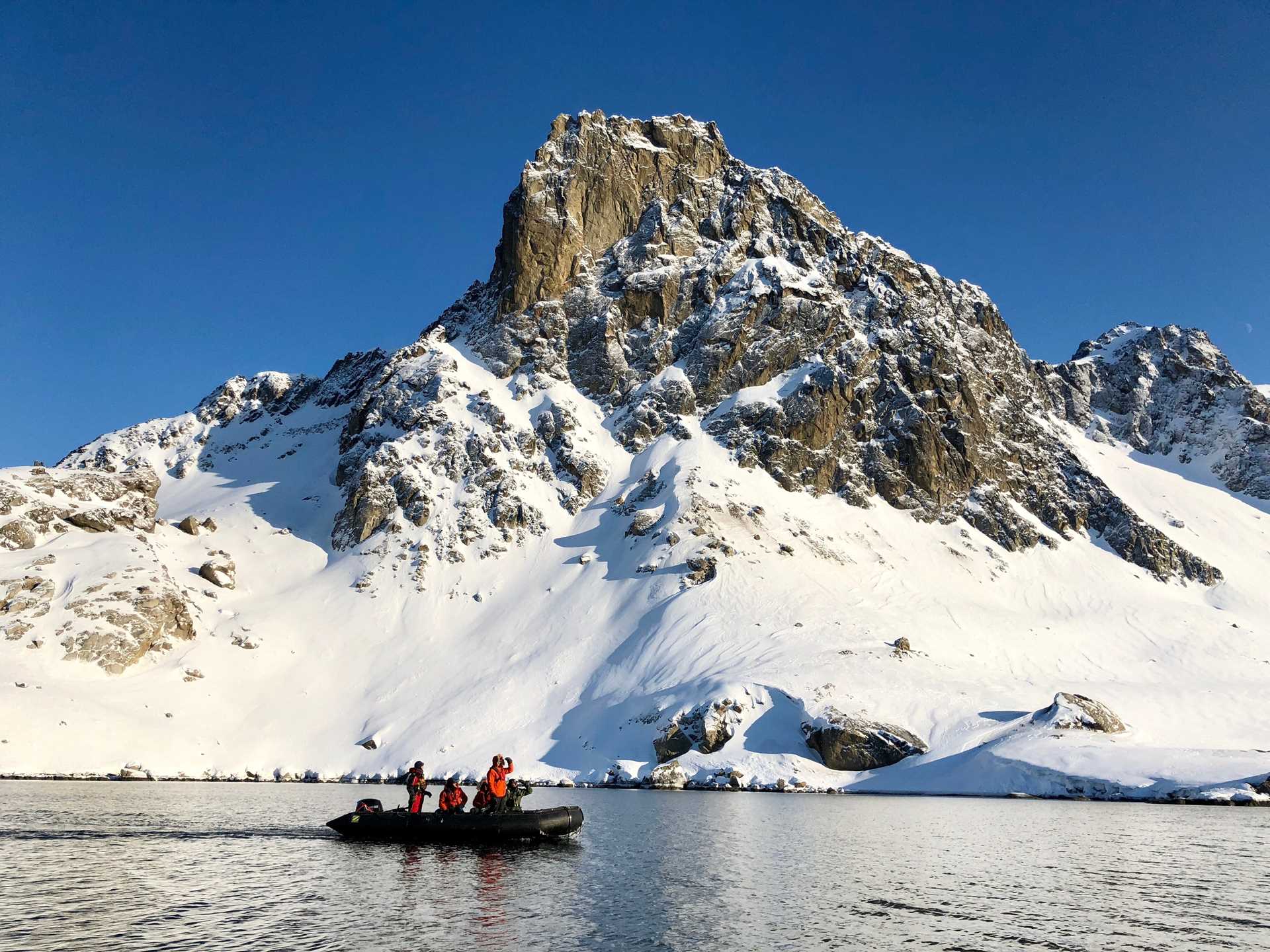 Guests in a Zodiac explore Svalbard, Norway