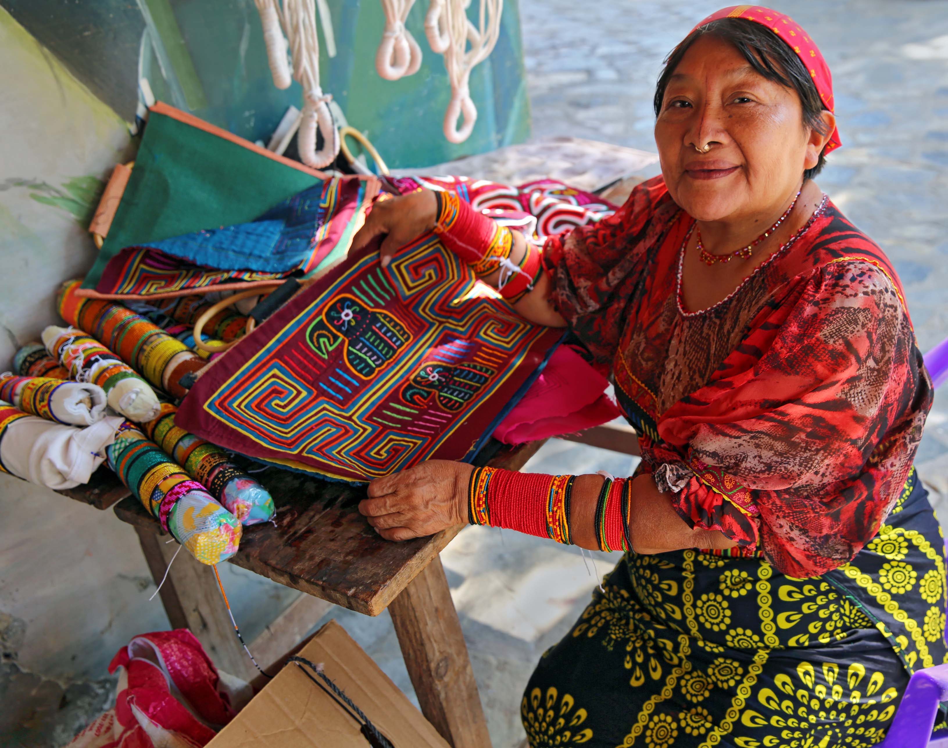 Guna woman with textiles