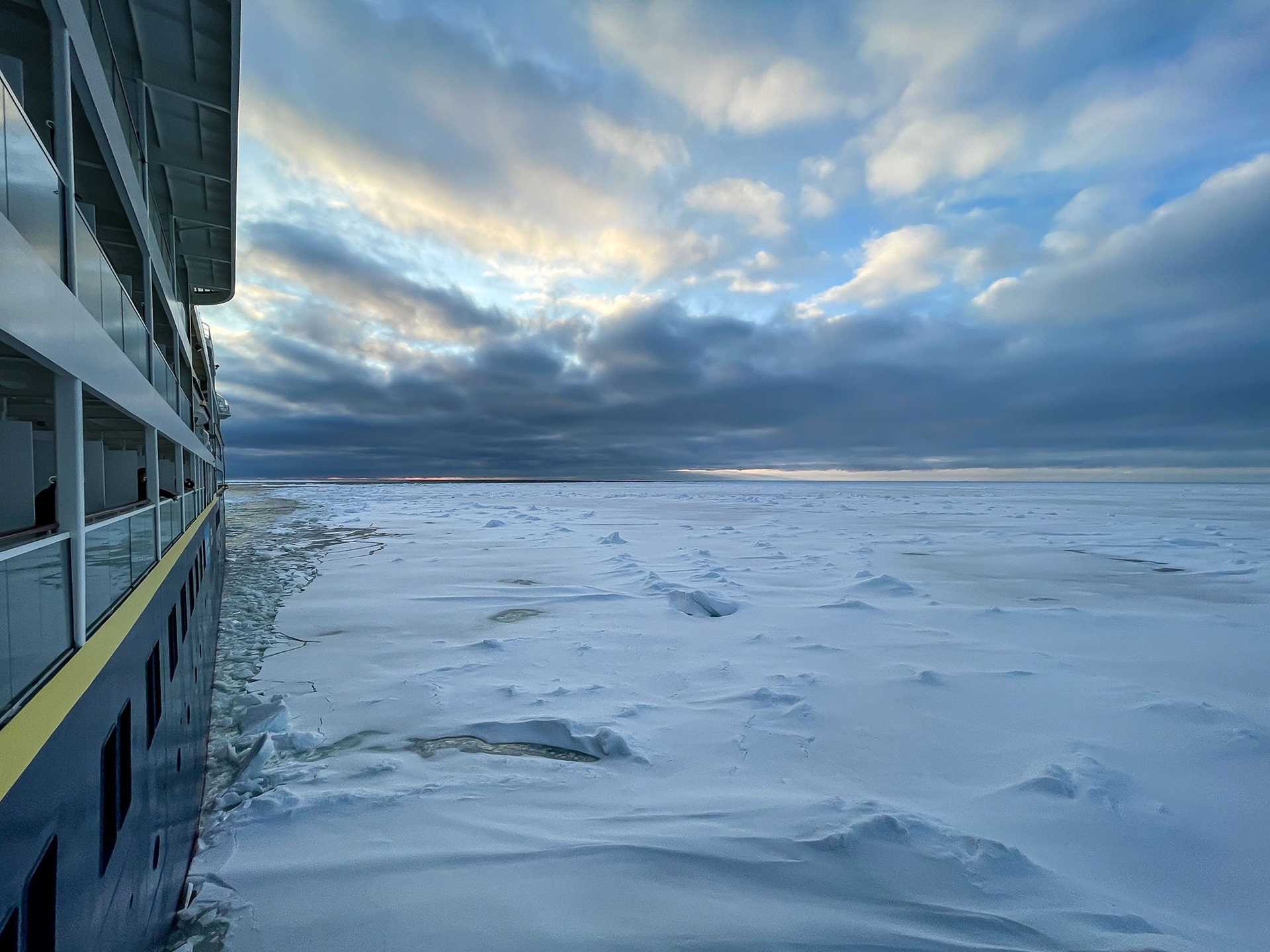 icy landscape and the side of a ship