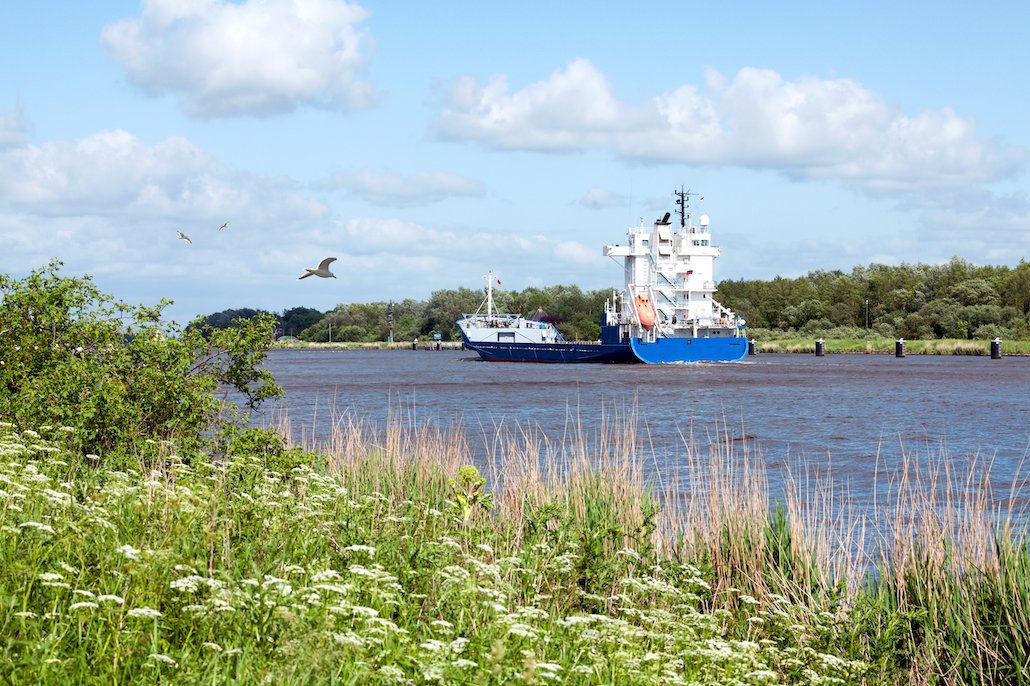 A Cargo Ship in the Idyllic Kiel Canal.jpg